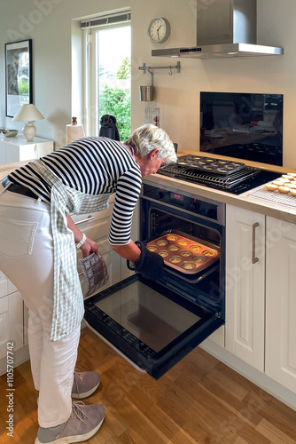 Woman in the kitchen baking cakes
