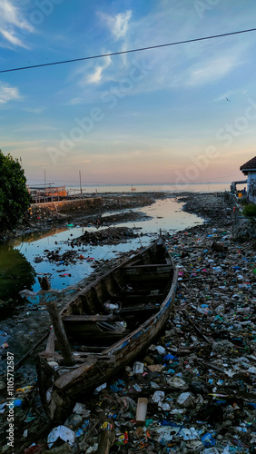 Water pollution due to human activities around downstream rivers and seas. damaged boats stranded among piles of rubbish. suitable for news, articles about issues of ecosystem damage and pollution.