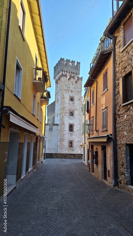 Fototapeta premium Sirmione, Italy - November 6, 2024: Scaliger Castle, the historic center of Sirmione, on the shores of Lake Garda.