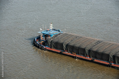 Aerial view of a cargo barge on a river. photo