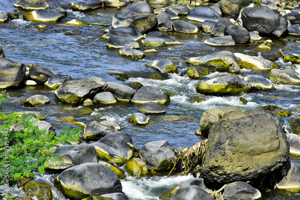 Fototapeta premium Beautiful, aesthetic and artistic river rocks with clear water in rural Asia Indonesia