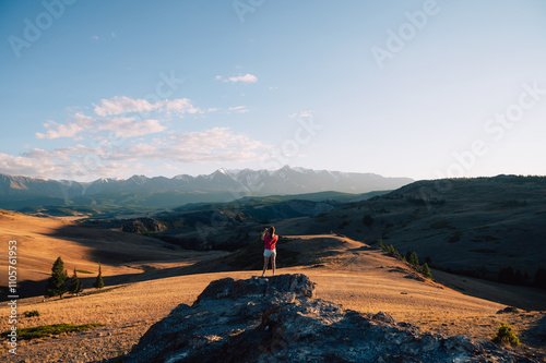 Woman Admiring Mountain Lan...