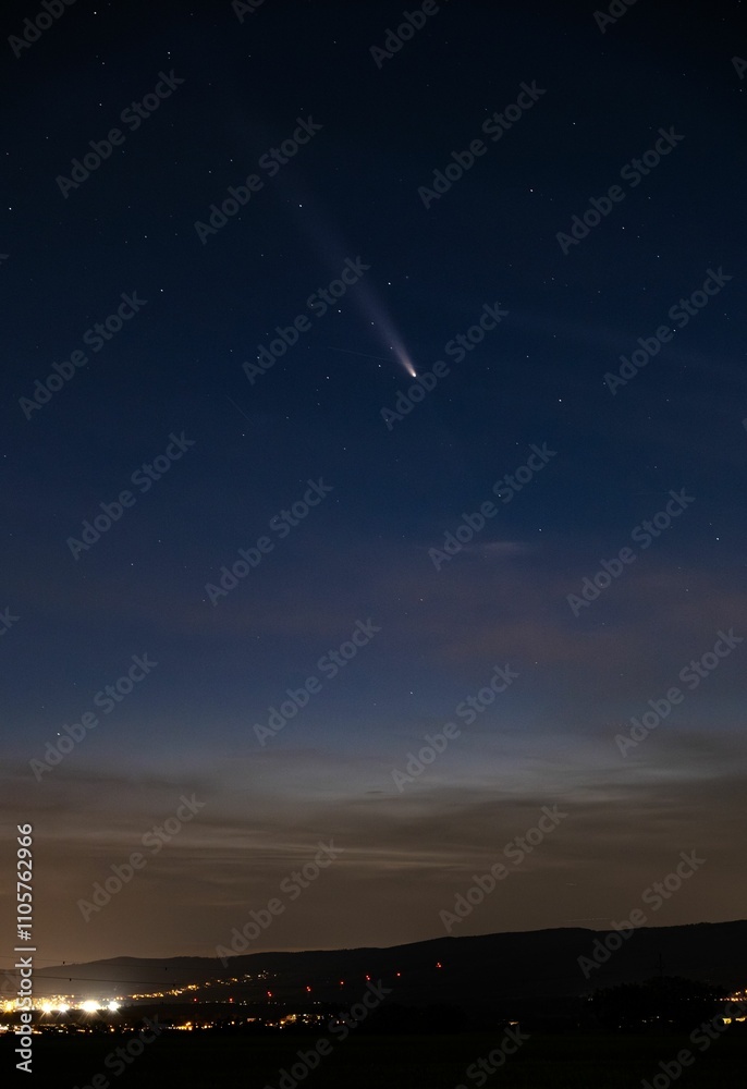 Comet over a starry night cityscape Comet over a starry night cityscape