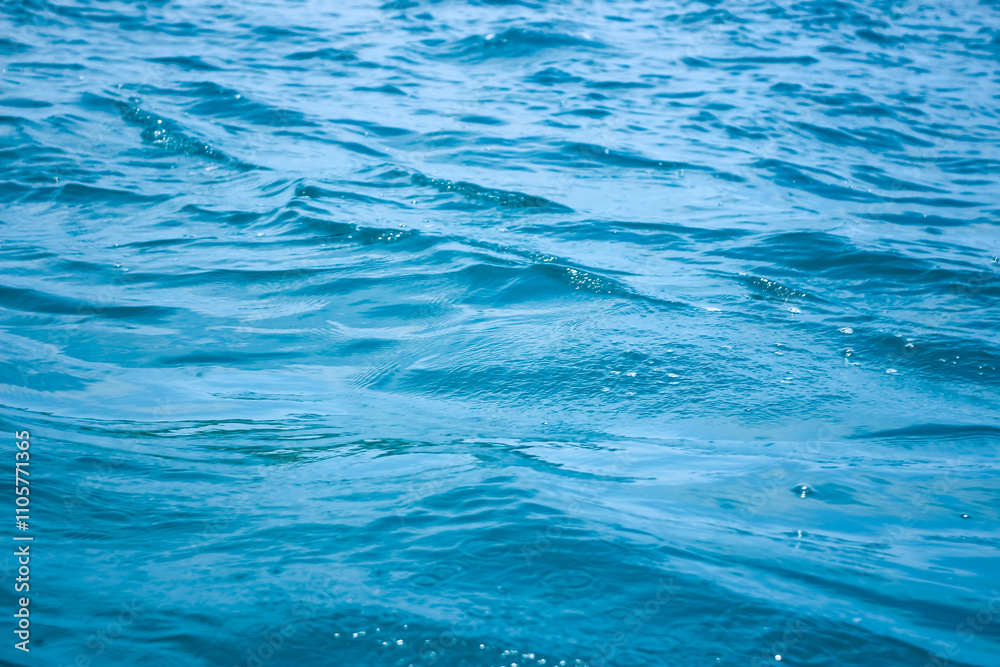 An abstract background of seawater flow under light exposure