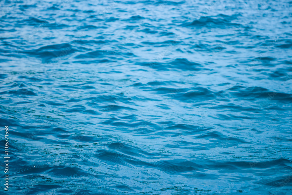 An abstract background of seawater flow under light exposure