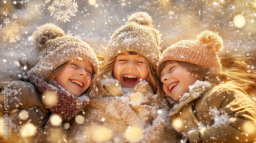 A group of children lies on the snow, enjoying themselves against a snowy backdrop.