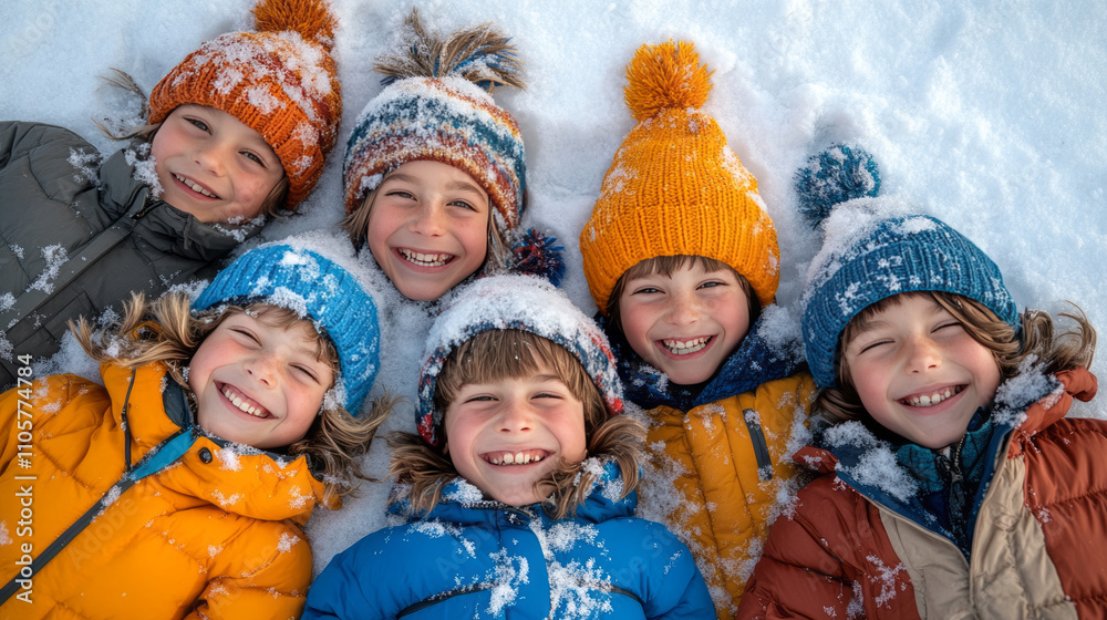 A group of children lies on the snow, enjoying themselves against a snowy backdrop. A group of children lies on the snow, enjoying themselves against a snowy backdrop.