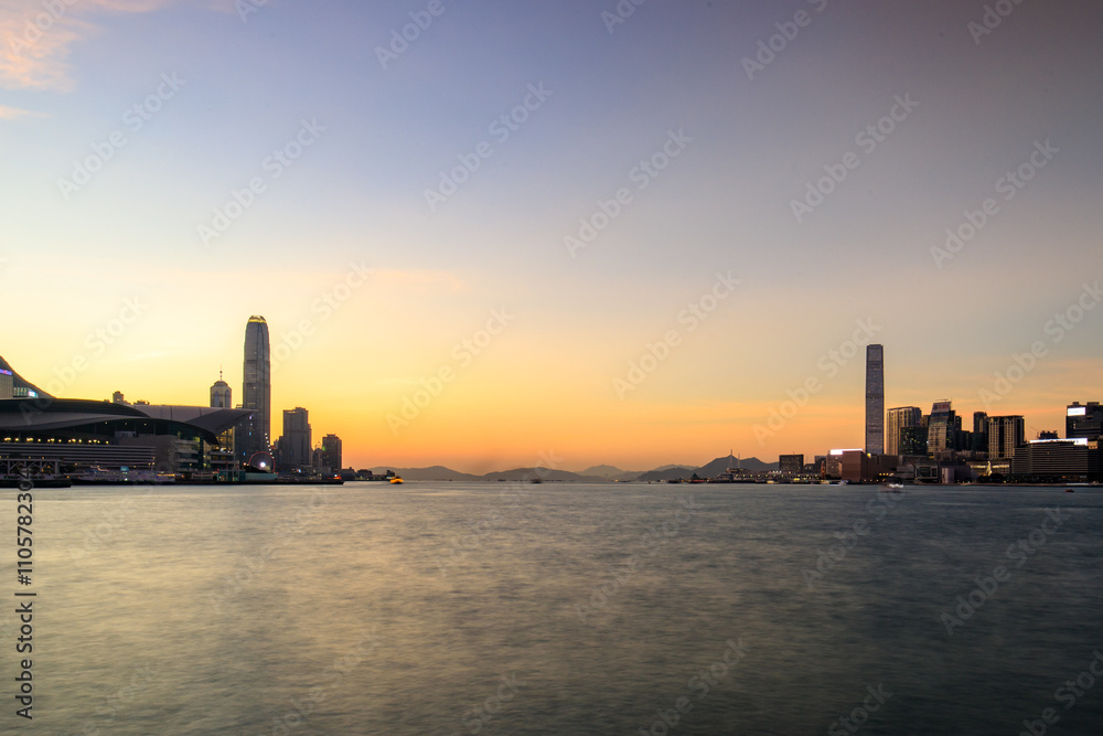 Serene Twilight Over Victoria Harbour with Hong Kong Skyline Serene Twilight Over Victoria Harbour with Hong Kong Skyline