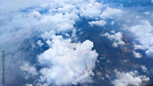 Aerial view of blue sky with fluffy white clouds. view from airplane window. Travel concept. freedom, adventure, wanderlust, relaxation
