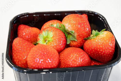 New spring harvest, one box of ripe Dutch red sweet strawberry on farmer market in the Netherlands