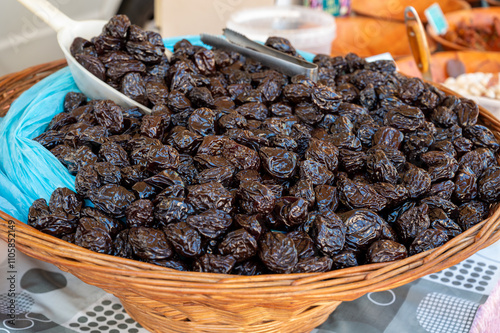 Bulk dried dehydrated black plums from Agen, France on local market in Biarritz