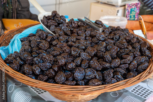 Bulk dried dehydrated black plums from Agen, France on local market in Biarritz