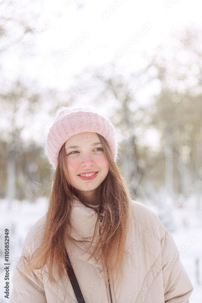 girl walking in a snowy park girl walking in a snowy park