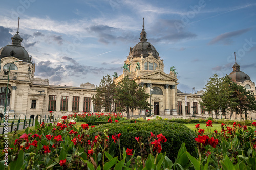 Budapest, Hungary. August 27, 2022. Shot at the entrance to the Széchenyi baths, the largest. The gardens with flowers frame the beautiful architectural complex. Travel destinations.