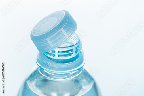 Vászonkép Close up of new cap attached to plastic bottle, connected to the neck of the bottle by solid tab attached to safety ring