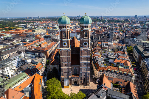 Beautiful aerial footage of Marienplatz the magestic New Town Hall, its clock and the Frauenkirche gothic church in the City of Munich Babaria Germany photo