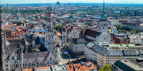 Beautiful aerial footage of Marienplatz the magestic New Town Hall, its clock and the Frauenkirche gothic church in the City of Munich Babaria Germany photo