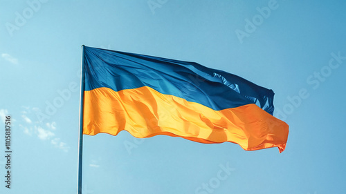 Ukrainian national flag waving against a clear blue sky, symbolizing freedom and patriotism photo