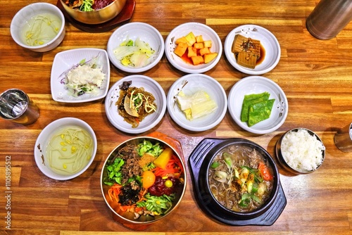 Banchan side dishes next to Jeonju bibimbap food