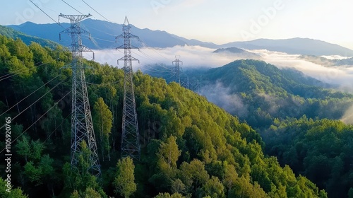 Power Lines Over Green Forests with Mountains and Fog in Background