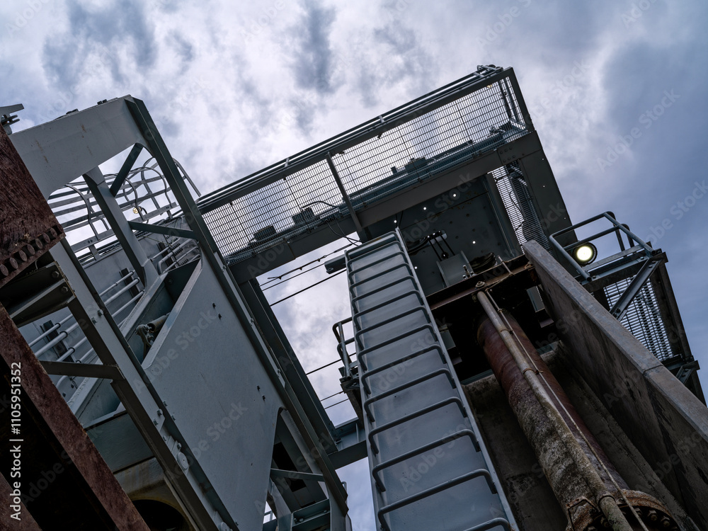 Upward view of a 70-ton crane at the Canyon Ferry Dam near Helena, Montana, USA Upward view of a 70-ton crane at the Canyon Ferry Dam near Helena, Montana, USA