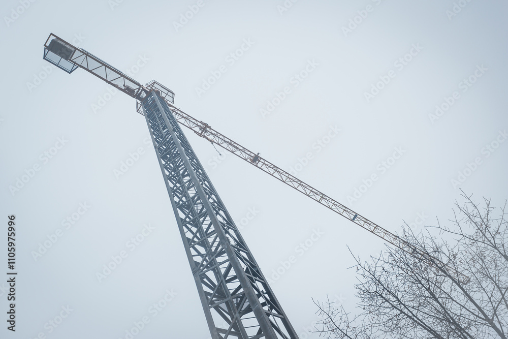 Urban construction site with crane. Low angle view. Belgrade, Serbia, Europe Urban construction site with crane. Low angle view. Belgrade, Serbia, Europe
