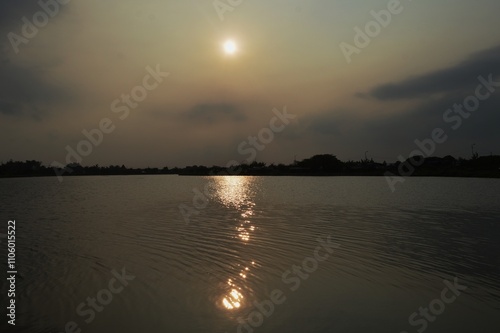 the reflection of the sun's rays before the sunset is very beautiful photo