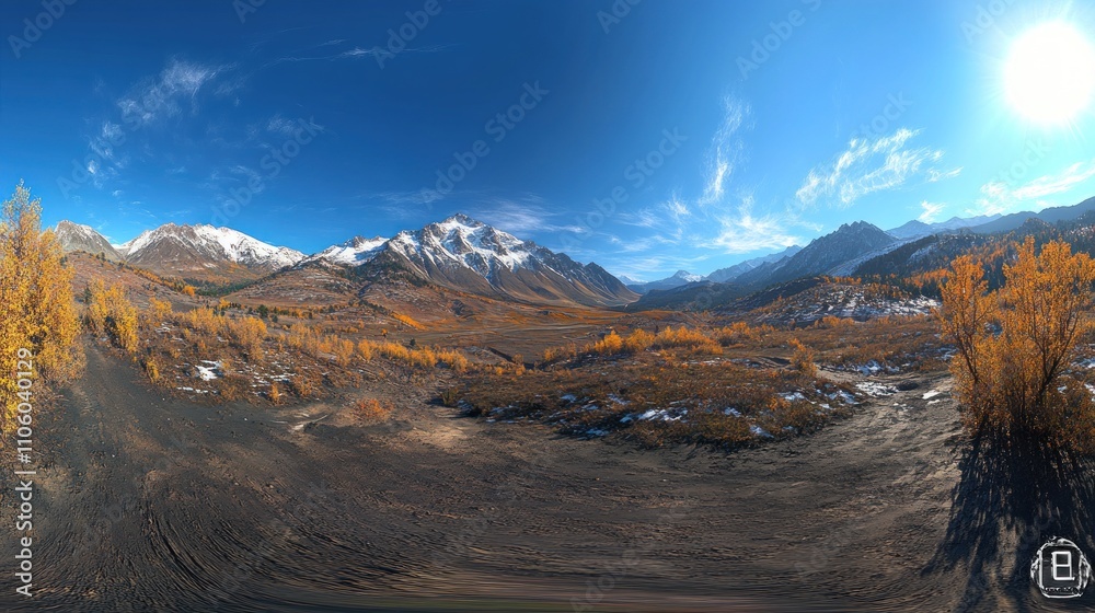 Obraz premium A panoramic view of a mountainous landscape with autumn foliage and snow-capped peaks.