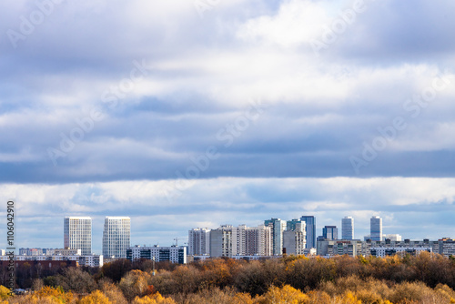 low dark blue cloudy sky over colorful city park photo