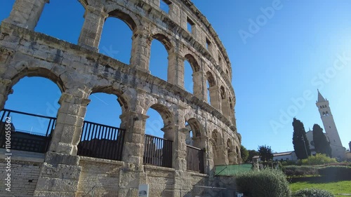 Pula, Croatia - November 3, 2024: View of the Amphitheater (Ancient Arena, Colosseum) monument of ancient Roman history and architecture. Ancient Roman stone walls.