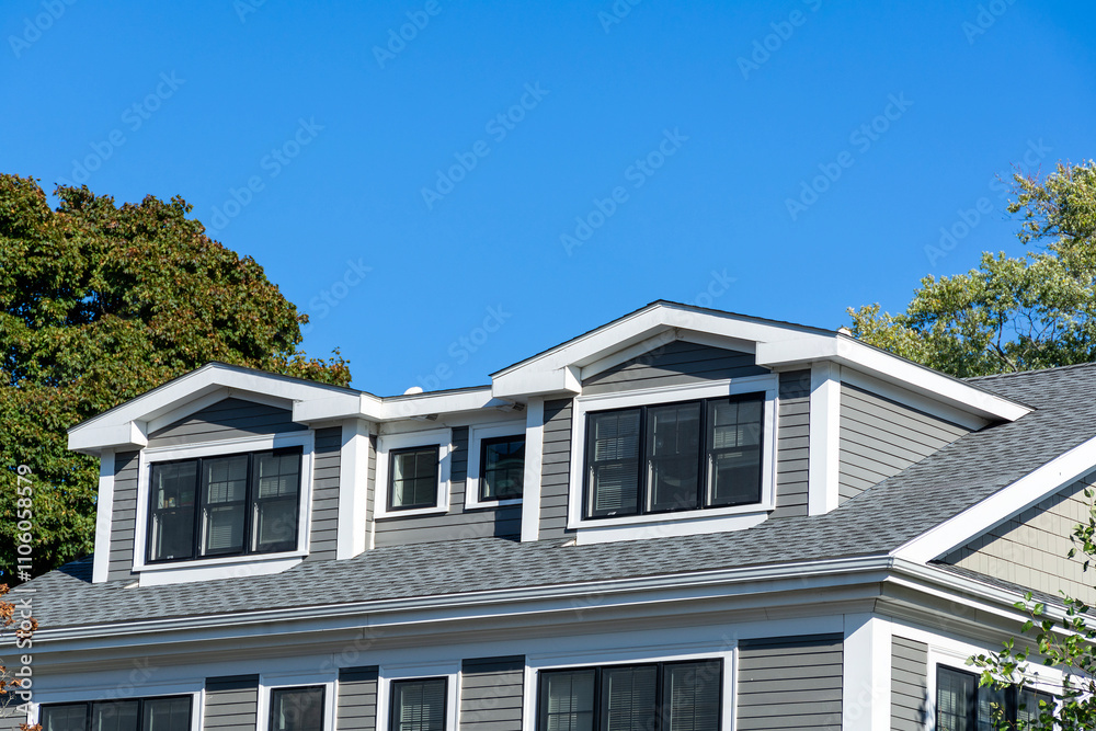 Modern residential home with dormer windows and gray siding in Brighton, Massachusetts, USA
Modern residential home with dormer windows and gray siding in Brighton, Massachusetts, USA