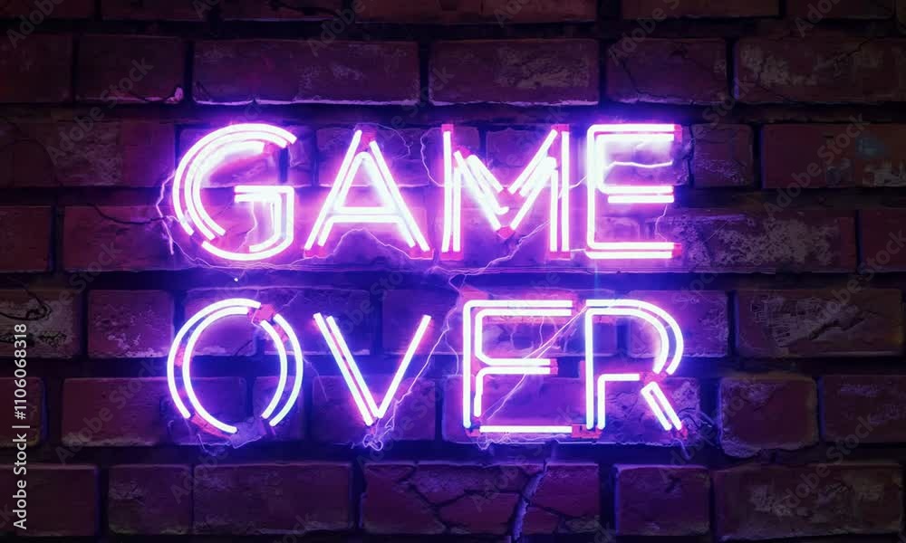Neon game over sign with glowing pink and blue lights on a brick wall background Neon game over sign with glowing pink and blue lights on a brick wall background