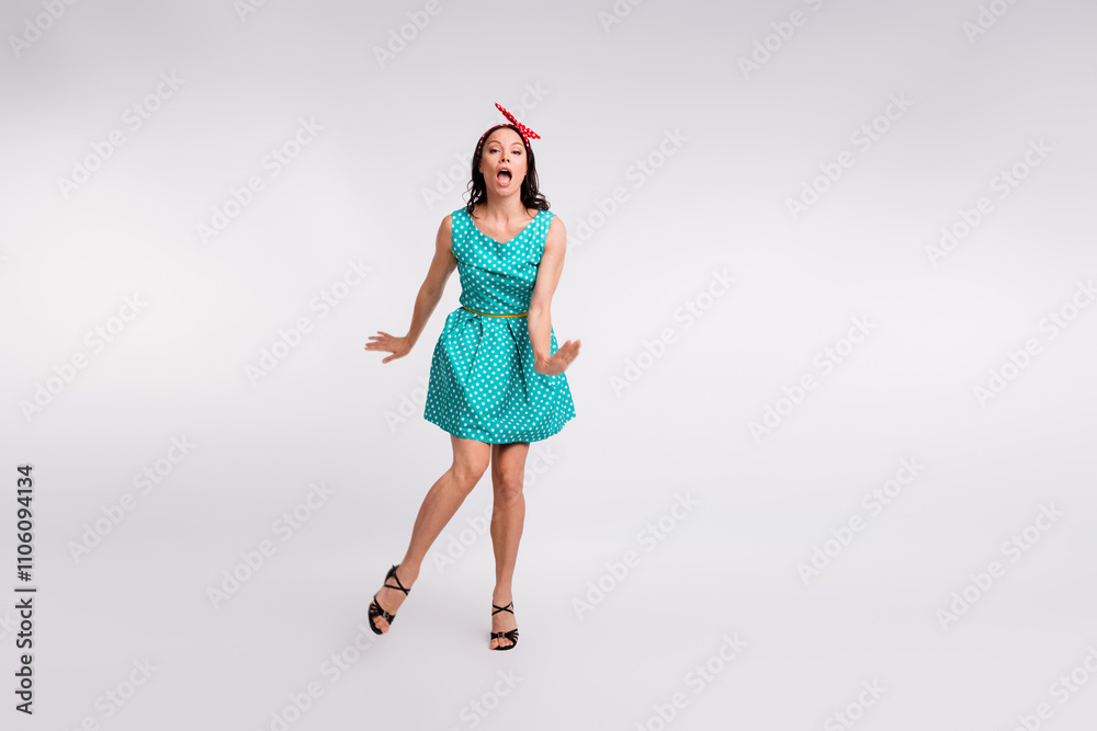 Full length photo of lovely lady good mood have fun dancing dressed teal retro style polka dot skirt isolated on white color background Full length photo of lovely lady good mood have fun dancing dressed teal retro style polka dot skirt isolated on white color background