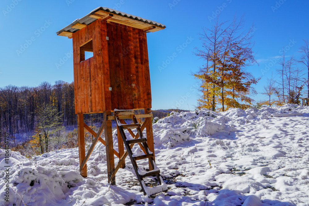Sitting for hunters on the edge of the field and forest. A hunter's pulpit hidden in the forest for hunting wild animals. High stand for hunters made of wood.
Sitting for hunters on the edge of the field and forest. A hunter's pulpit hidden in the forest for hunting wild animals. High stand for hunters made of wood.