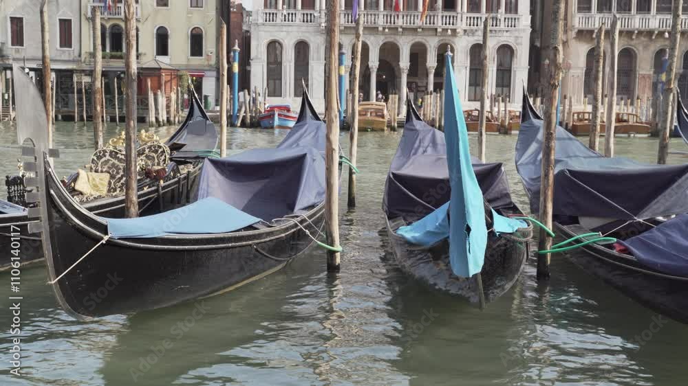 Gondolas floating on canal in venice italy Gondolas floating on canal in venice italy