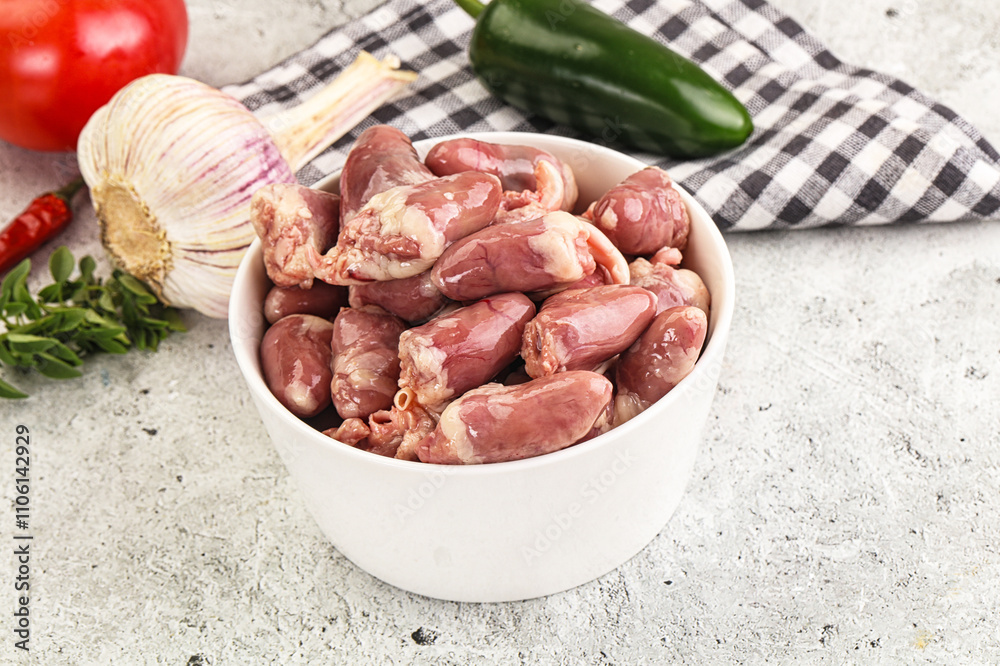 Fresh raw chicken hearts in the bowl Fresh raw chicken hearts in the bowl