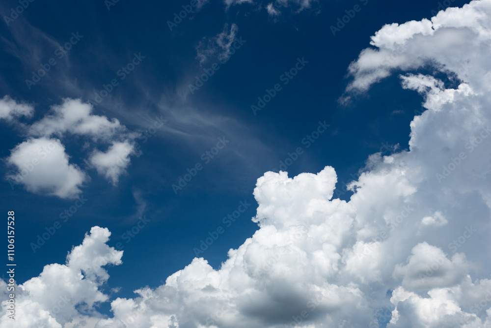 Obraz premium Blue Sky with Puffy White Clouds