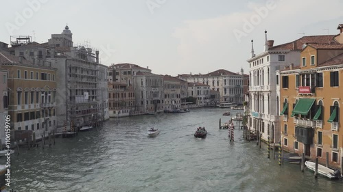 Water taxi transporting tourists on a sunny day in venice
