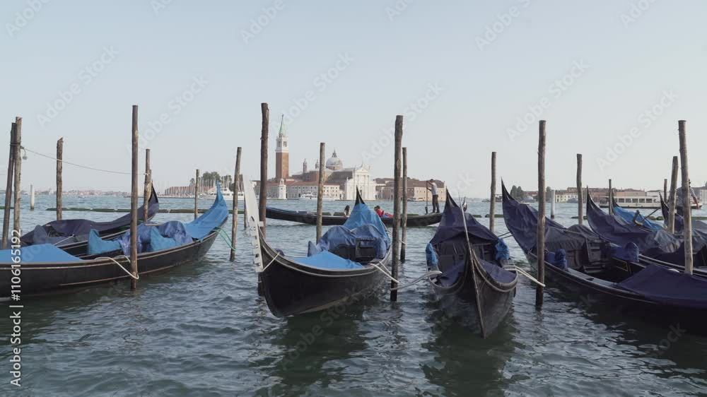 Gondoliers preparing gondolas in venice italy
