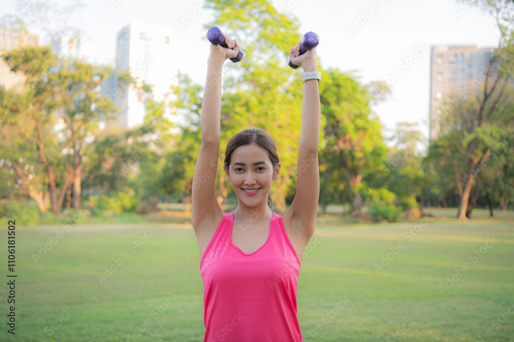 Woman exercising outdoors with dumbbells. Woman exercising outdoors with dumbbells.