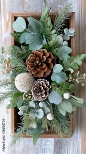Decorative arrangement of pinecones and greenery for a festive celebration in...