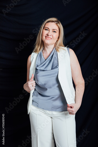 Business woman 45 years old in white business suit