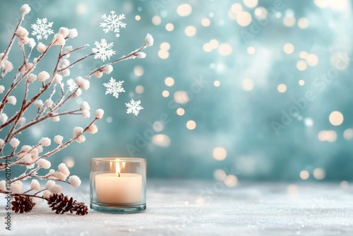Winter decoration with frosty branches and glowing candle on a blue background