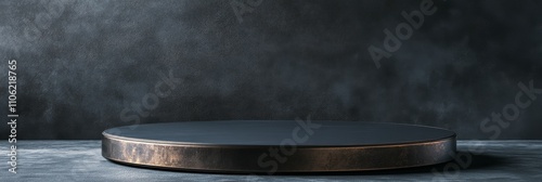 Minimalistic black display stand with soft lighting against a textured dark wall