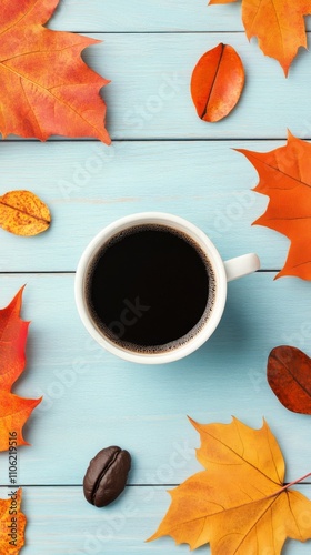 Warm coffee cup surrounded by colorful autumn leaves on vibrant blue wooden t...