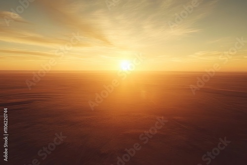 Golden sunset over flat, orange landscape.