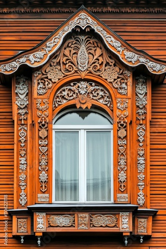 Ornate wooden window  intricate carvings  orange wood.