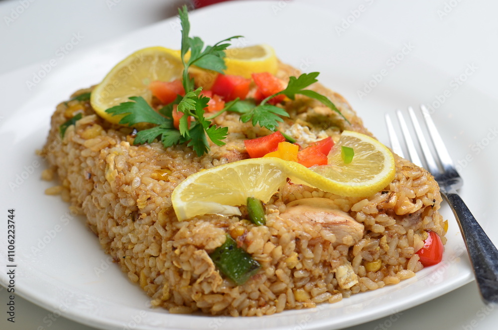 A food shot of the iconic Lebanese dish fish and rice. A dish made from fish fillet and rice served along a tahini salad. A food shot of the iconic Lebanese dish fish and rice. A dish made from fish fillet and rice served along a tahini salad.