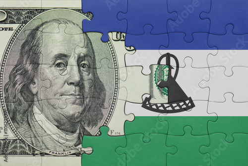 Wallpaper Mural puzzle with the national flag of lesotho and the usa dollar money .finance concept Torontodigital.ca