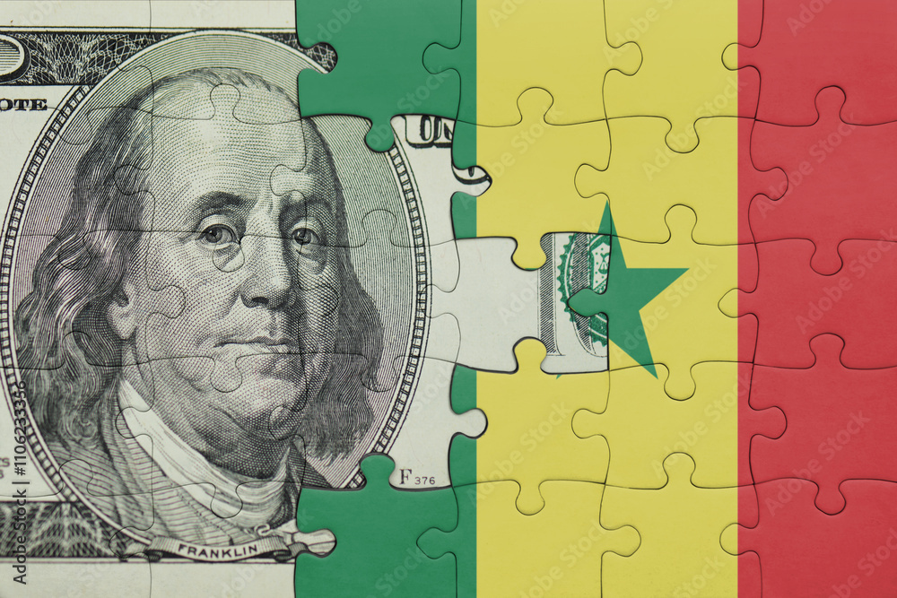puzzle with the national flag of senegal and the usa dollar money .finance concept puzzle with the national flag of senegal and the usa dollar money .finance concept